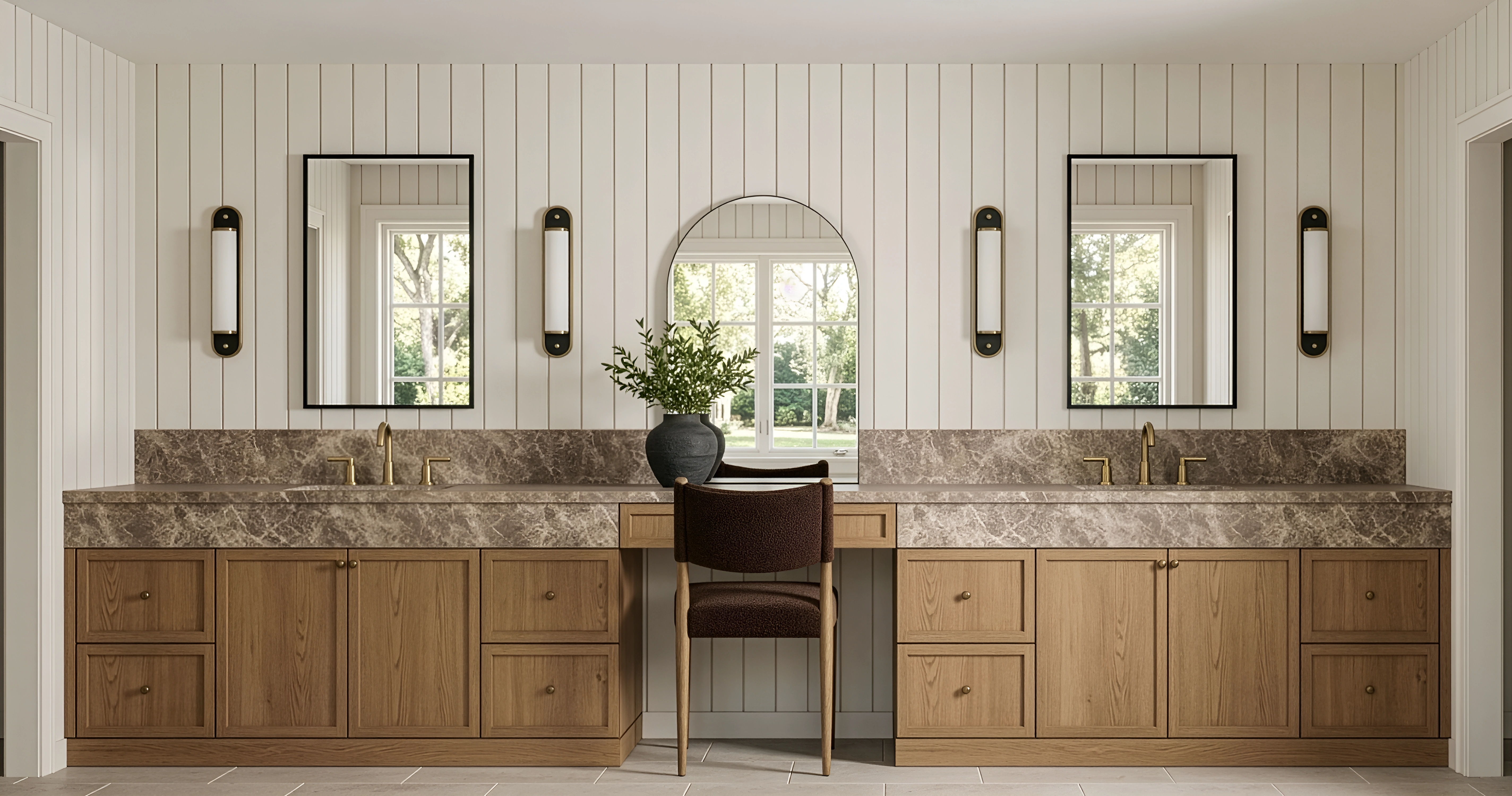 Primary bathroom with double vanity, brass fixtures, and shiplap walls designed by Chelsey Rain Interiors